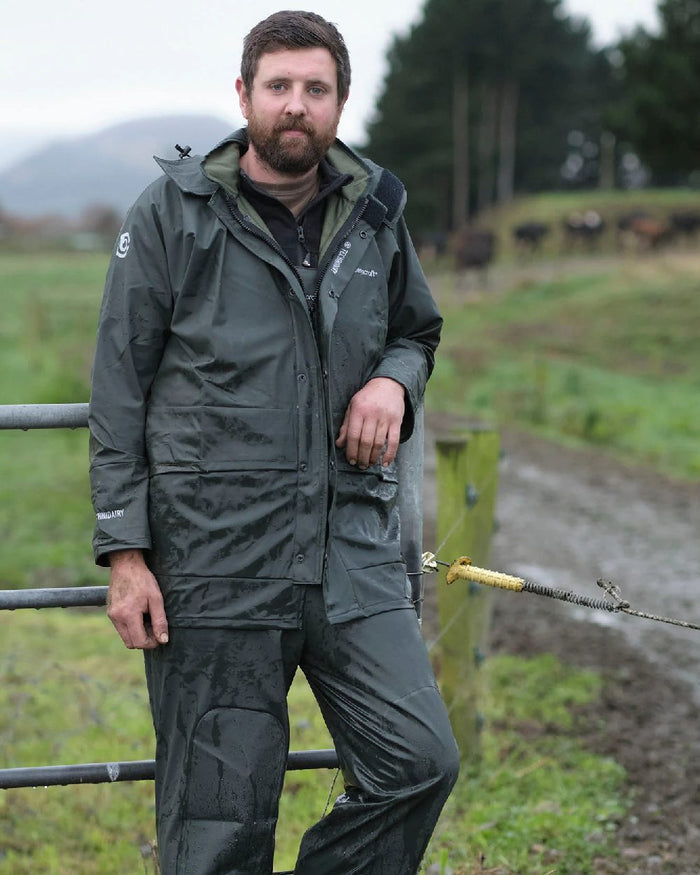 Green coloured Betacraft Technidairy Parka on farm background #colour_green