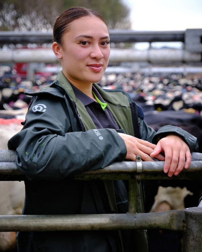 Green coloured Betacraft Technidairy Parka on blurry background #colour_green