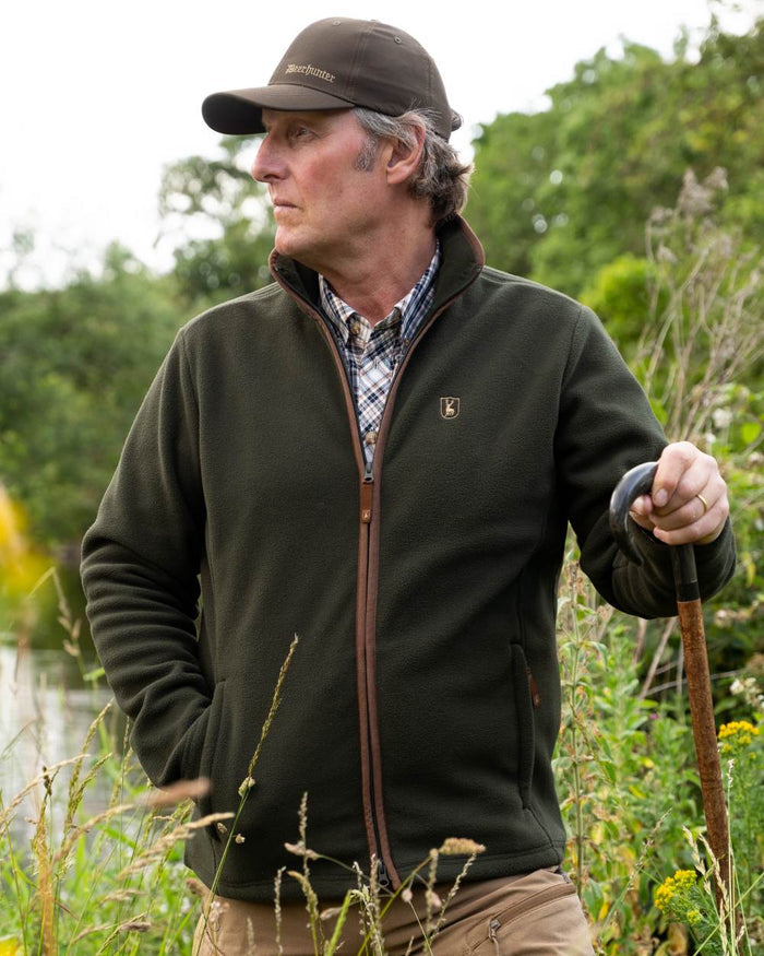 Forest Ember coloured Deerhunter Mens Cumbria Fleece Jacket on forest background #colour_forest-ember