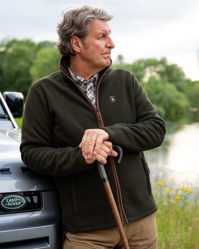 Forest Ember coloured Deerhunter Mens Cumbria Fleece Jacket on forest background #colour_forest-ember