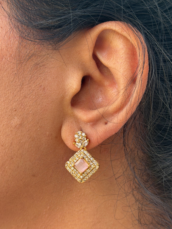 earring with white stone and pink
