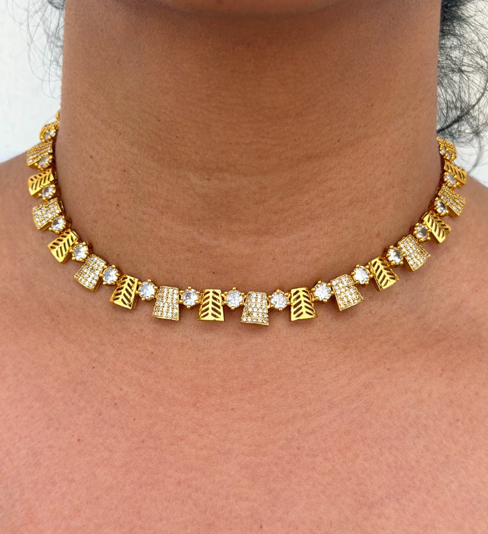 Gold necklace with geometric designs