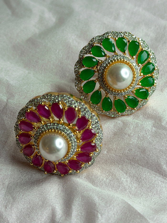 Pair of earrings with green and red gemstones
