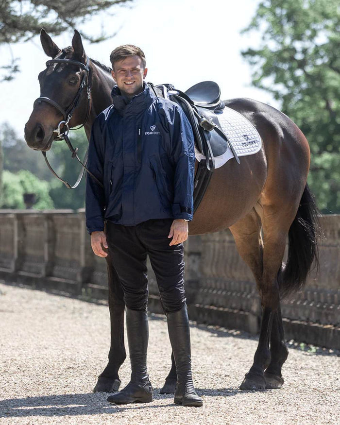 Navy coloured Equidry Mens Equimac Shortie With Stowaway Hood on outdoor background #colour_navy