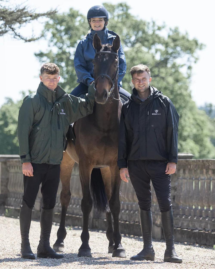 Black coloured Equidry Mens Equimac Shortie With Stowaway Hood on outdoor background #colour_black