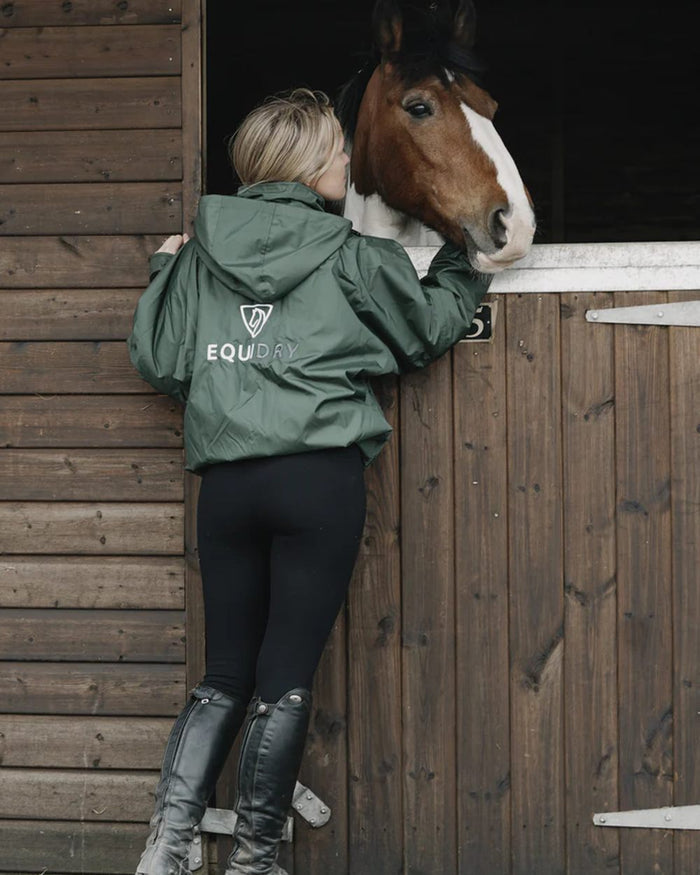 Black Forest Green coloured Equidry Womens Shortie Thin Fleece Jacket With Stowaway Hood on outdoor background #colour_black-forest-green