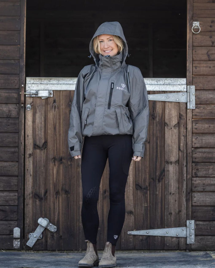 Charcoal coloured Equidry Womens Equimac Shortie With Stowaway Hood on outdoor background #colour_charcoal