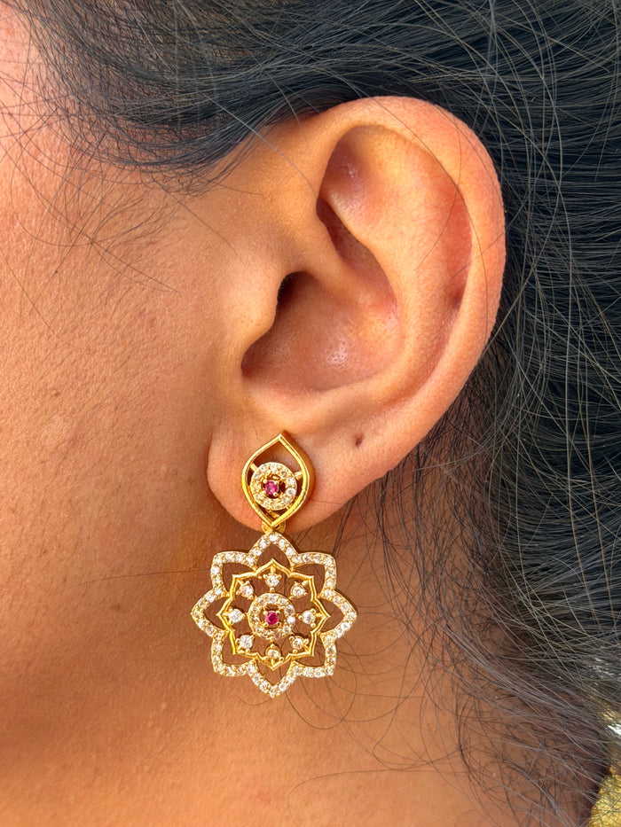 gold earring wth pink stone