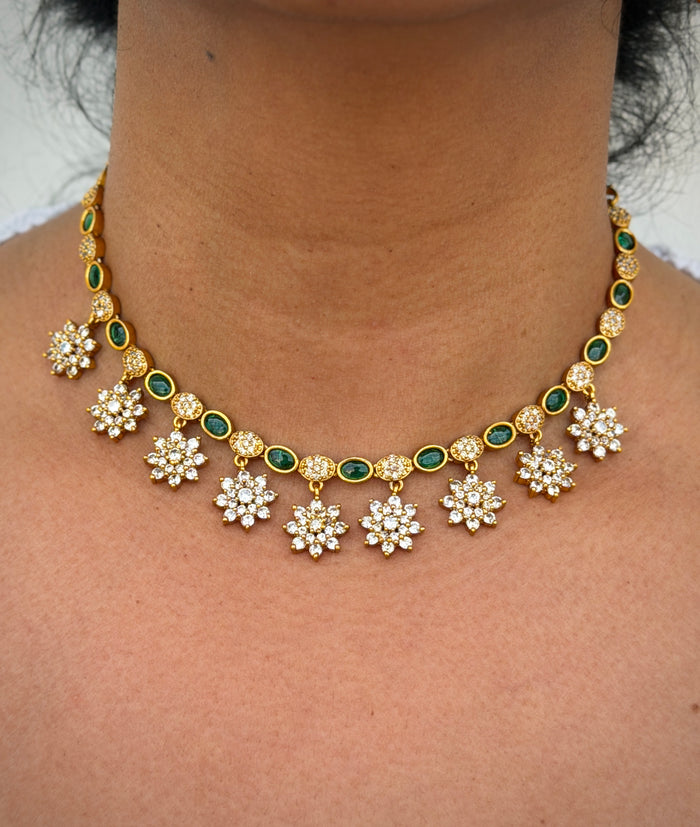 Gold necklace with floral designs