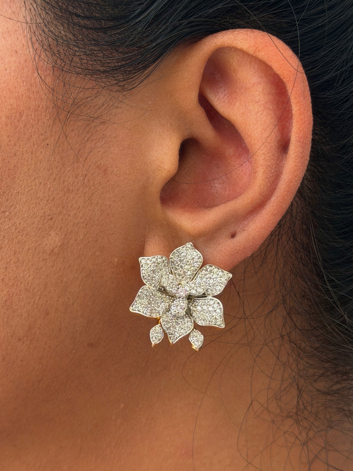 ear wearing a diamond earring