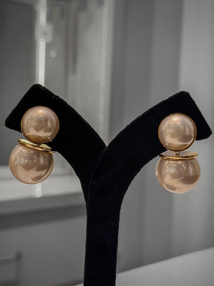 women earring with white stone
