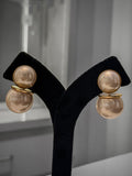 women earring with white stone