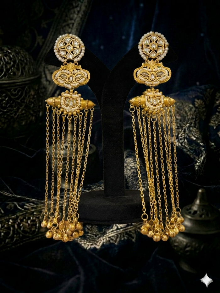 gold earrings with intricate designs