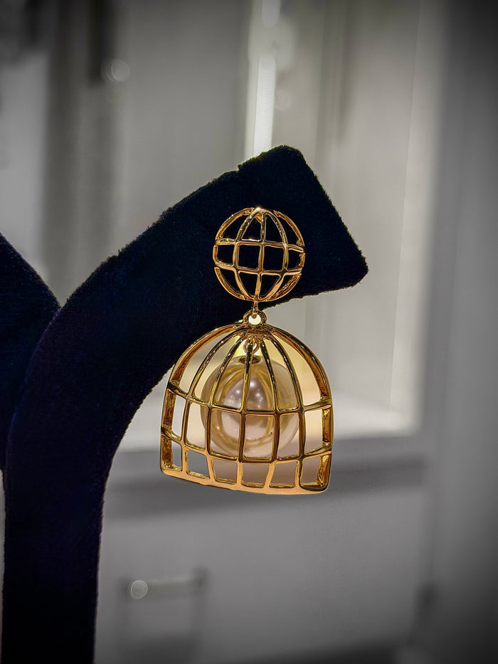 Gold cage earring with pearl center