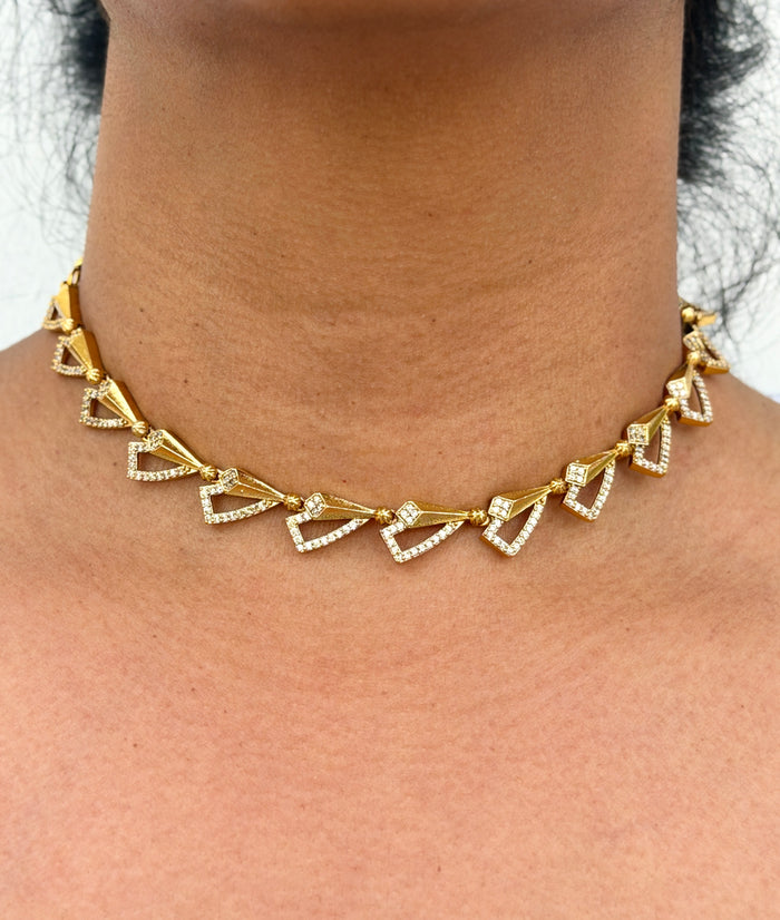 Gold necklace with heart-shaped pendants