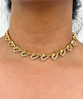 Gold necklace with heart-shaped pendants
