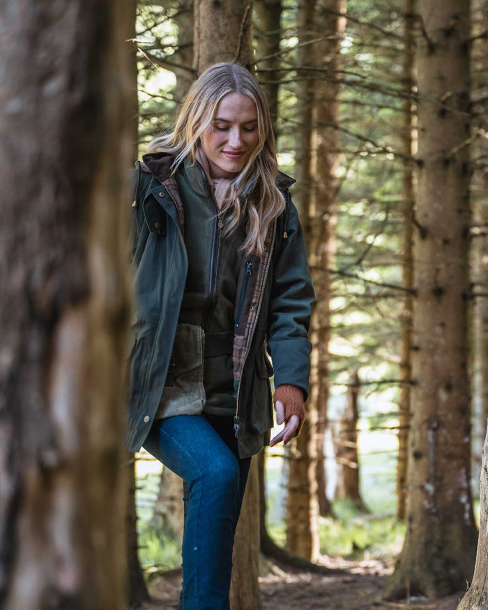 Forest Green Coloured Hoggs of Fife Womens Kelso Waterproof Waxed Jacket on outdoor background #colour_forest-green