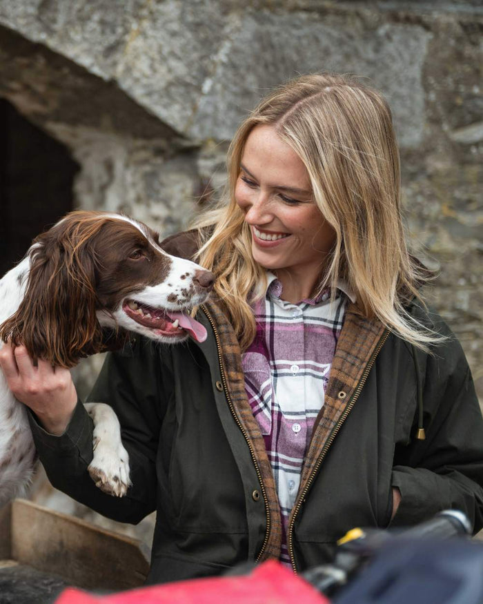 Forest Green Coloured Hoggs of Fife Womens Kelso Waterproof Waxed Jacket on outdoor background #colour_forest-green