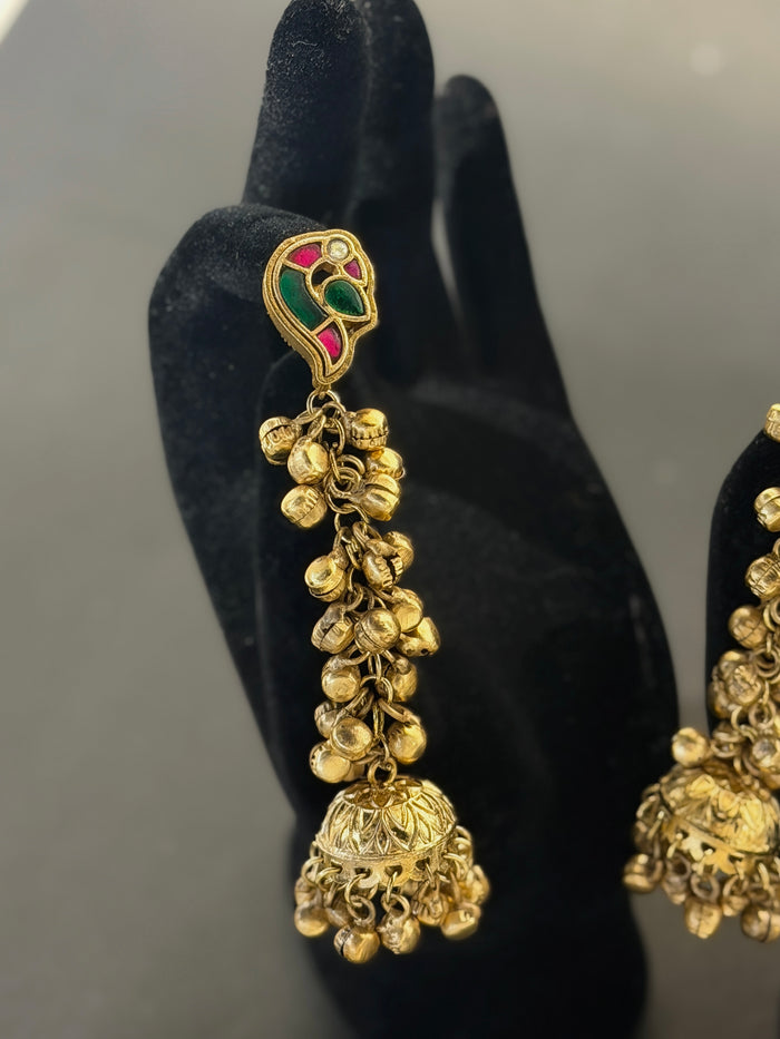 Gold earrings with intricate designs