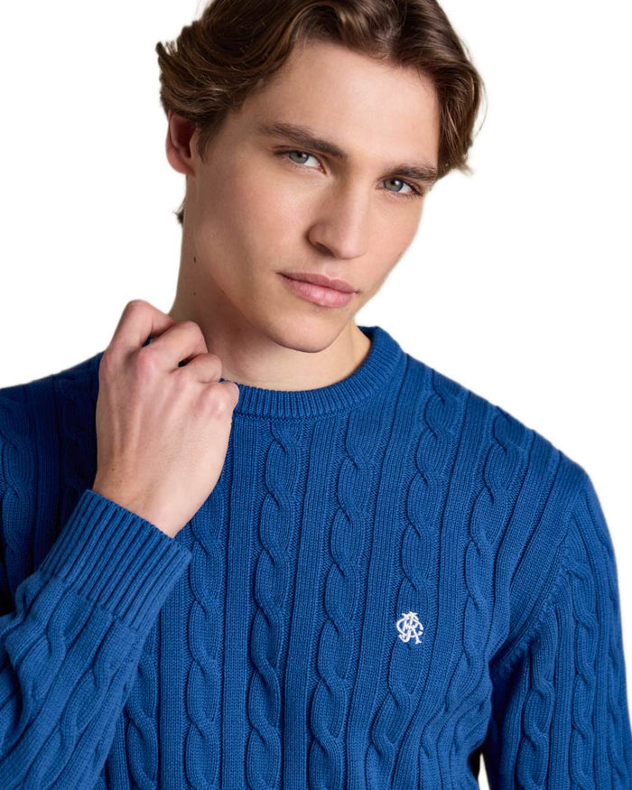 Navy coloured Joules Mens Crew Neck Cotton Cable Knit Jumper on white background #colour_navy