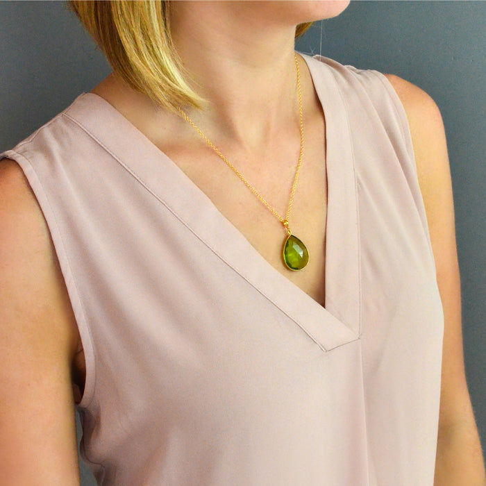 Shop our green peridot necklace collection available in large, medium and small teardrops, prong set teardrop, prong set diamond, large and medium rounds on model. Birthstone for December