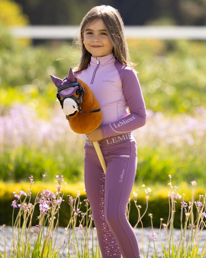 Sundance coloured LeMieux Hobby Horse Lite Sundance on garden background #colour_sundance