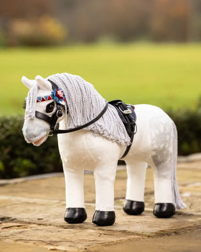 Brown coloured LeMieux Toy Pony Showing Numnah Brown on garden background #colour_brown