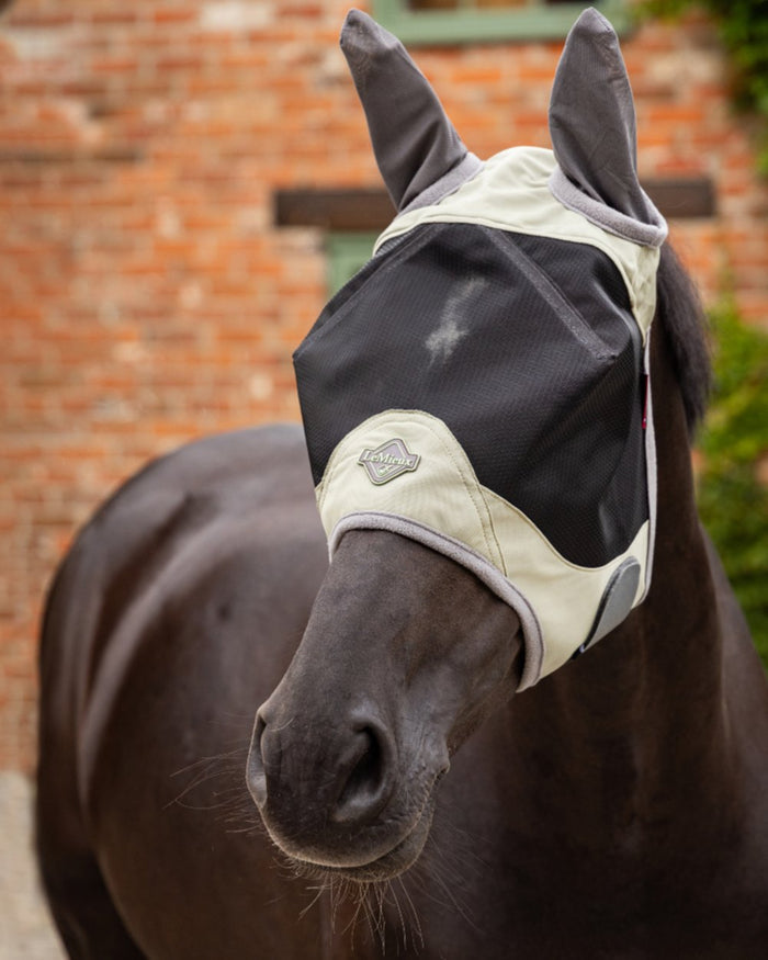 Fern coloured LeMieux Visor-Tek Half Fly Mask on outdoor background #colour_fern