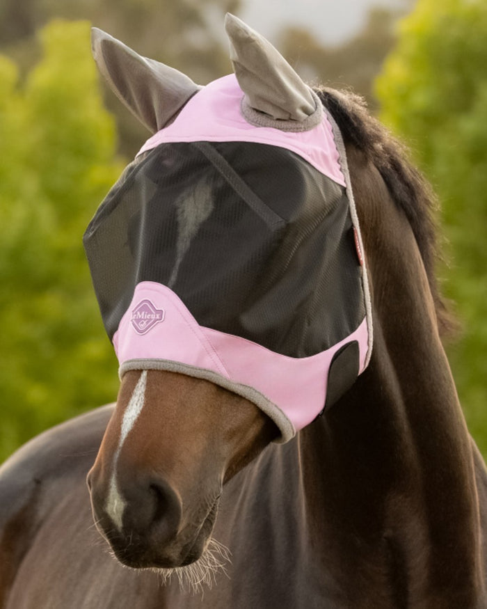 Fondant coloured LeMieux Visor-Tek Half Fly Mask on outdoor background #colour_fondant