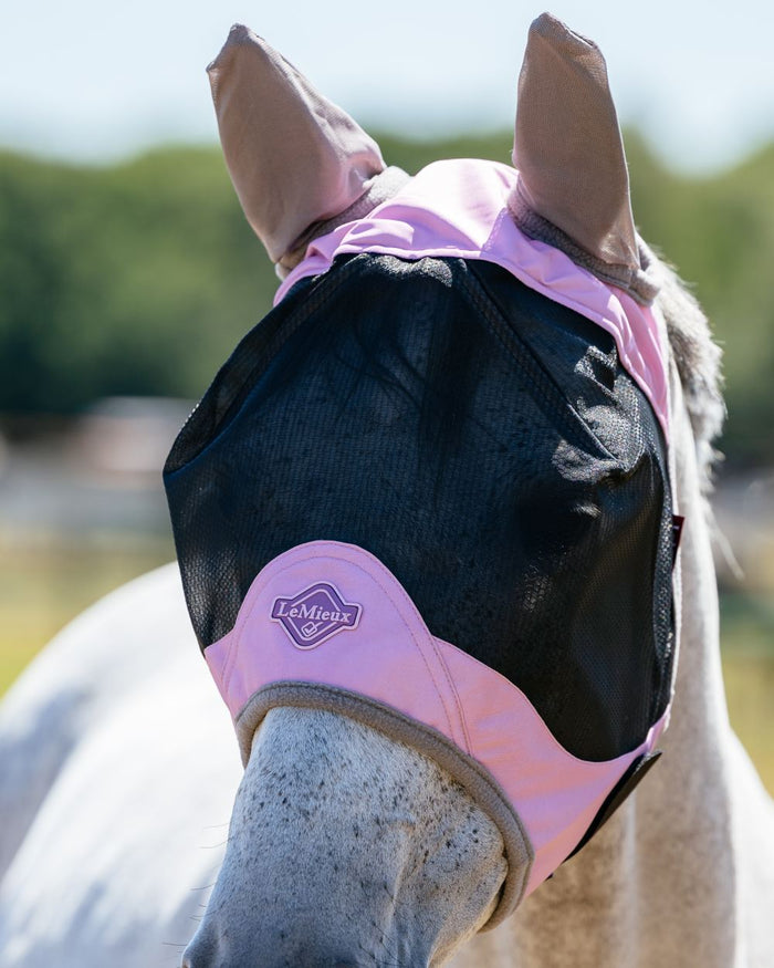 Fondant coloured LeMieux Visor-Tek Half Fly Mask on outdoor background #colour_fondant