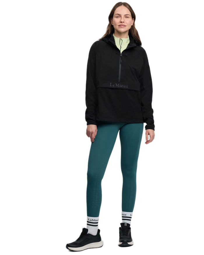 Black coloured LeMieux Womens Perri Half Zip Waterproof Jacket on white background #colour_black