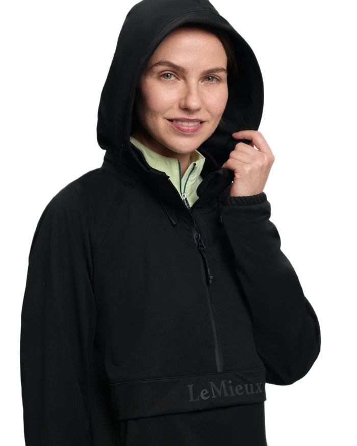 Black coloured LeMieux Womens Perri Half Zip Waterproof Jacket on white background #colour_black