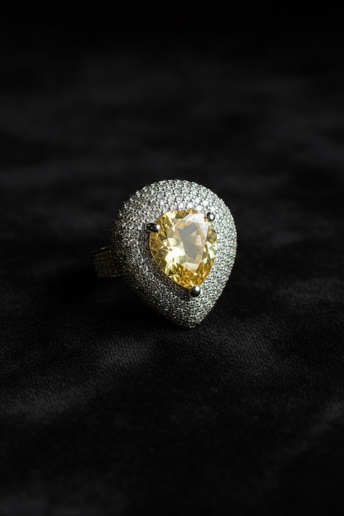 Ring with a yellow gemstone and diamond