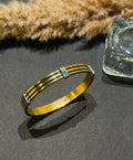 Gold bracelet with a blue gemstone