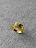 Gold ring with intricate design