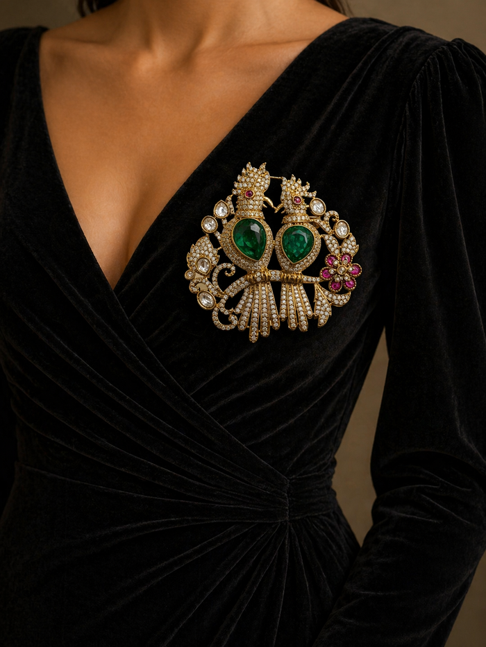 Black velvet dress with a large ornate brooch