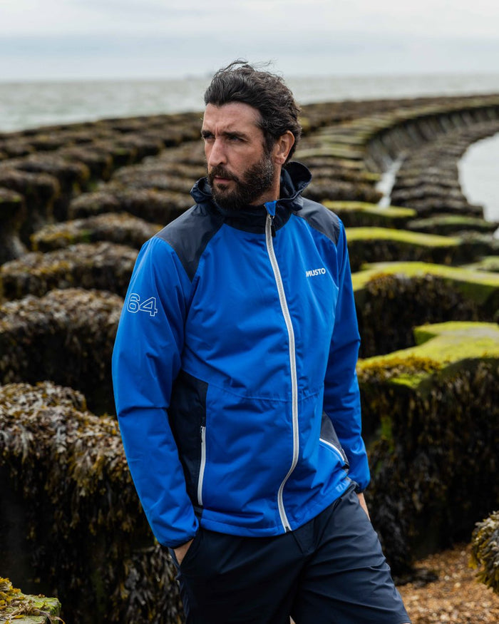 Navy Coloured Musto Mens RIB Fast Dry Shorts On A Coastal Background #colour_navy