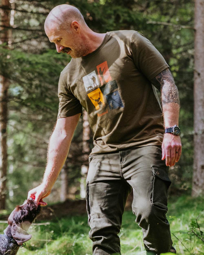 Olive Melange coloured Pinewood Mens Hunting T-Shirt on forest background #colour_olive-melange