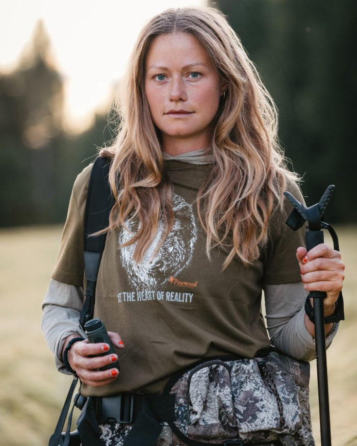 Hunter Olive coloured Pinewood Womens Wild Boar T-Shirt on blurry background #colour_hunter-olive