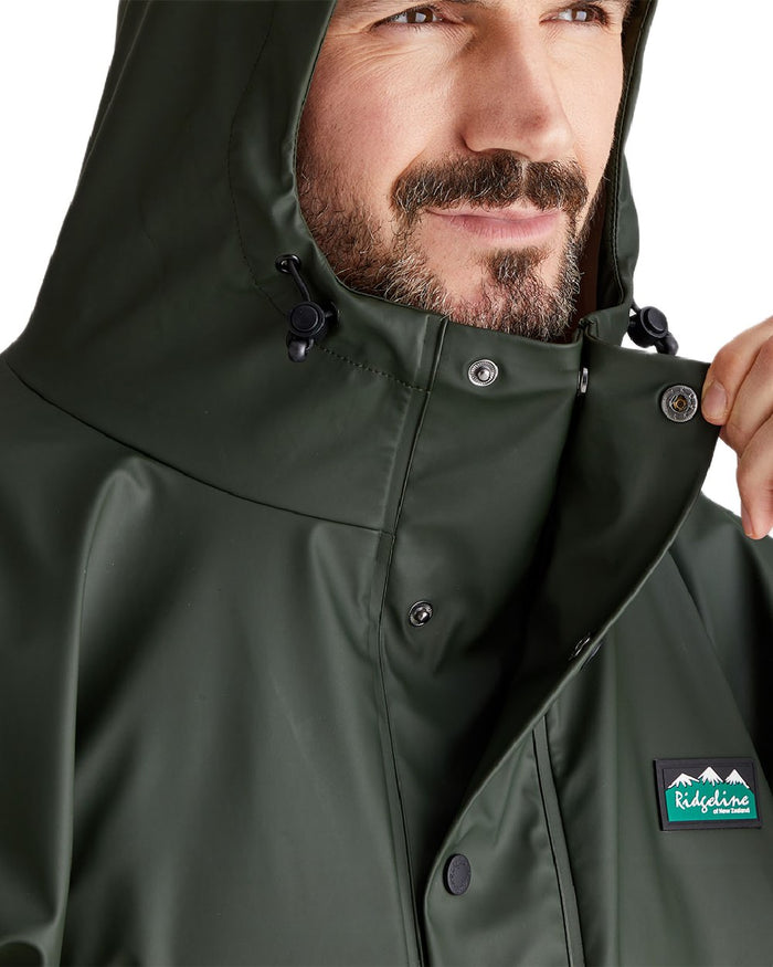 Deep Forest Coloured Ridgeline Signature Poncho on white background #colour_deep-forest