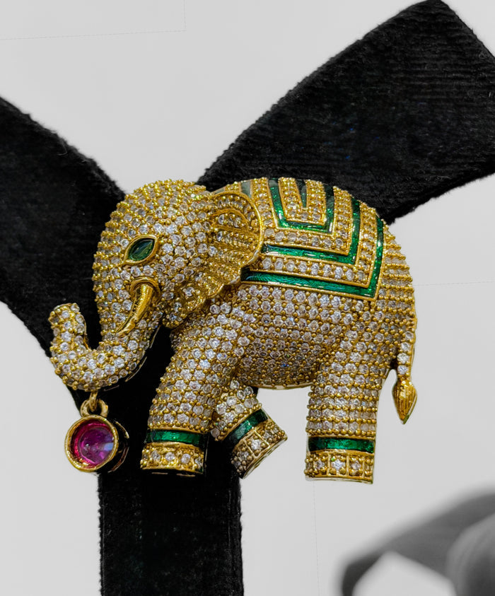 Gold elephant brooch