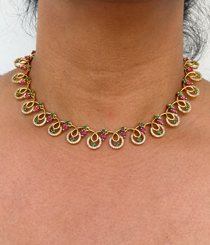 Gold necklace with gemstones