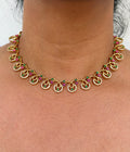 Gold necklace with gemstones