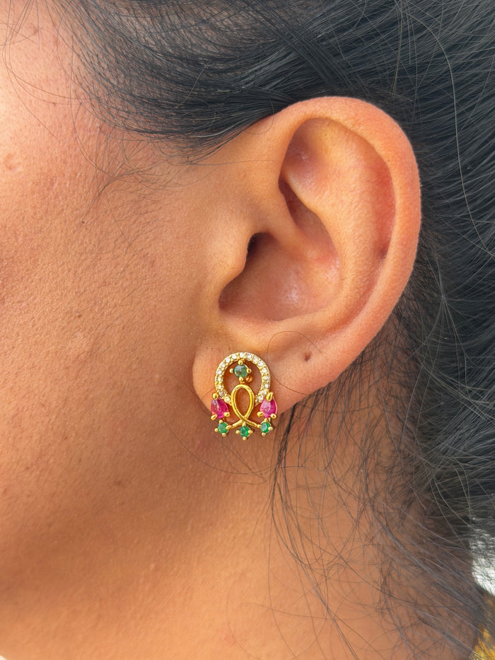 Gold earring with gemstones
