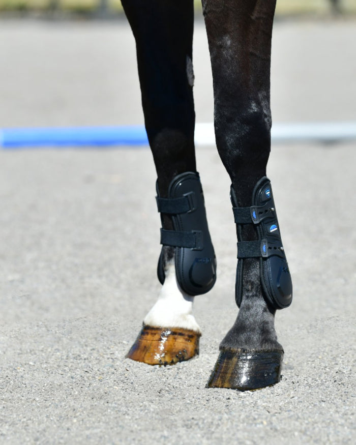 Black Coloured WeatherBeeta Tough-Tec Essential Open Front Boots on horse background #colour_black