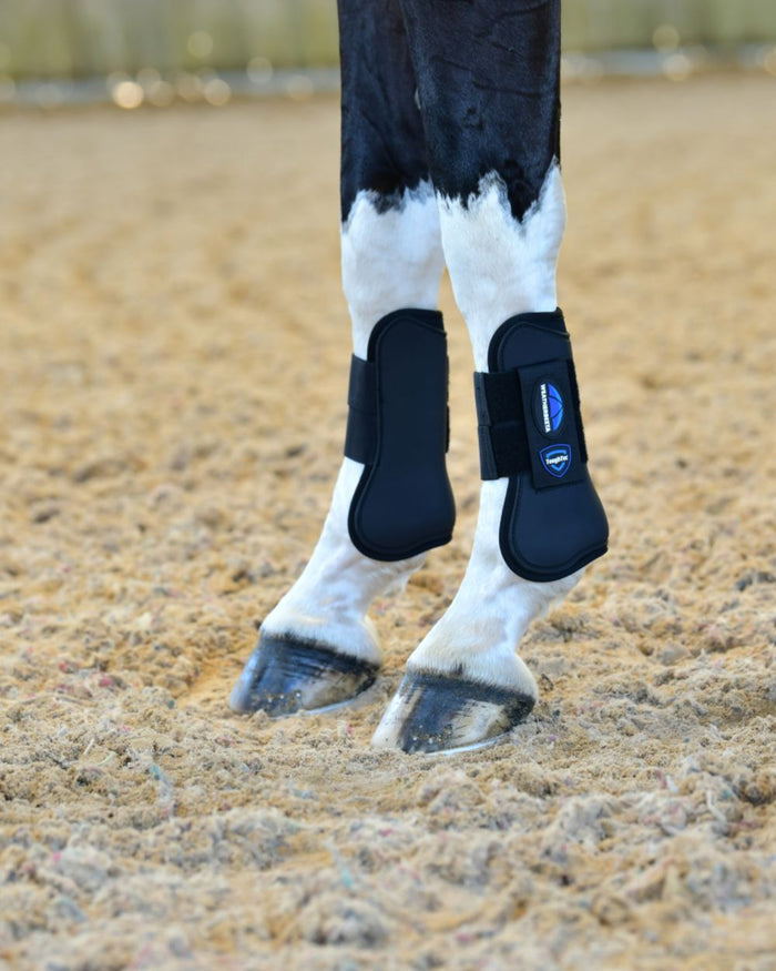 Black Coloured WeatherBeeta Tough-Tec Prime Open Front Boots on horse background #colour_black